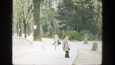 1949: girl and boy walking in a park CINCINNATTI OHIO