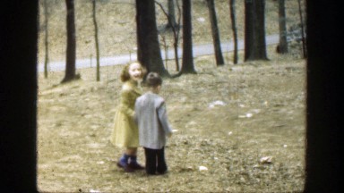 1949: two children holding hands walking outside. CINCINNATTI OHIO