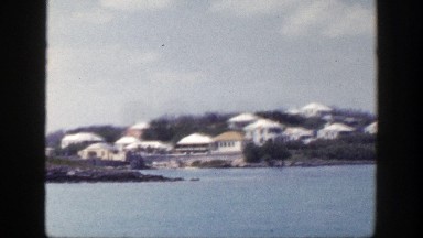 1948: View of a Body of Water with a Vessel and Housing in the Distance, New York