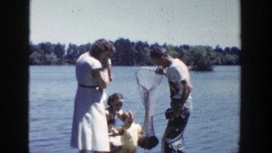 1953: Family Fishing with Net in Wisconsin