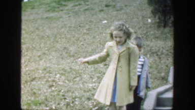 1949: Girl and Boy Children Walking Down Concrete Stairs Outside