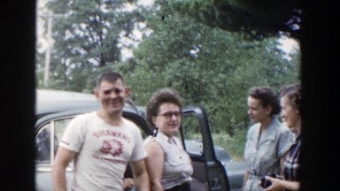 1953: Family Greeting One Another and Visiting by Their Car, Wisconsin