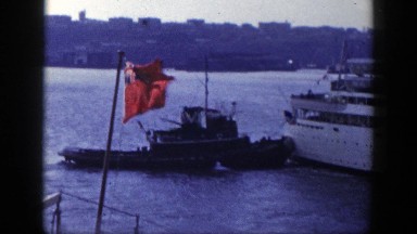 1948: View of a Flag Flying on a Lake in New York