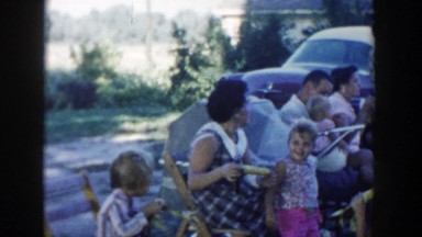 1954: People Eating Corn at Outdoor Celebration in Wisconsin Dells Wisconsin