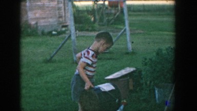 1957: little boy working out in his front yard. MICHIGAN