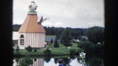 1954: A Large Clown Head Sits on Top of a Small Building in a Park Wisconsin