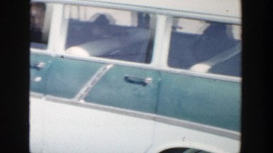 1956: man trying to communicate outside of his car window. GRAND RAPIDS MICHIGAN