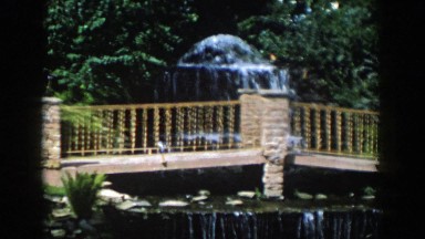 1954: a cascading waterfall in a scenic route of a botanical garden. WISCONSIN