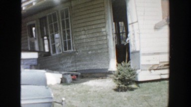 1956: viewing of a normal looking house that has been damaged by a storm.