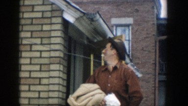 1957: a man gathers his belongings and leaves his house MICHIGAN