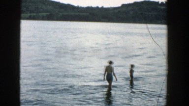 1957: Mother and Child Standing in Water While Others Swim, Wisconsin