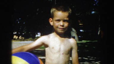 1957: cute topless kid holding ball outdoor posing MICHIGAN