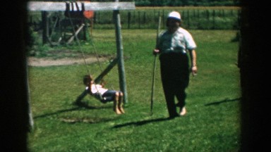 1957: people walking back from their garden work. MICHIGAN