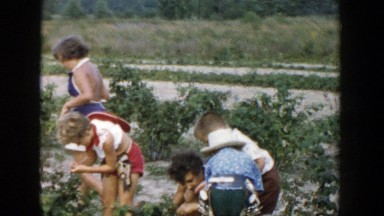 1957: children helping in the garden. MICHIGAN