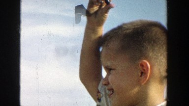 1957: a little boy heads outside to pick blueberries with his mom MICHIGAN