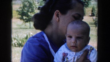 1958: woman with child enjoying the great outdoors while the weather is nice