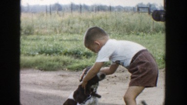 1958: kid playing with a dog MICHIGAN