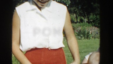 1958: mother outside playing with her children. MICHIGAN