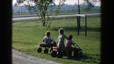 1958: children playing in their little red wagons! MICHIGAN