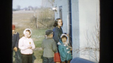 1958: family can't get into house when they return home on a winter day.