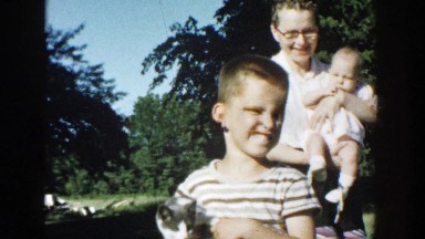 1958: boys holding kittens and mother holding the little baby MICHIGAN