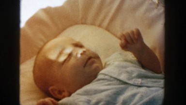 1958: a baby laying in the crib MICHIGAN