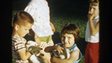 1958: mom introduces kids to the new kittens. MICHIGAN