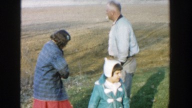 1958: man with kids outside playing and enjoying each other's company