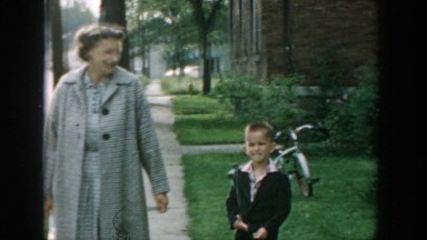 1964: mother and son walking down the sidewalk. WISCONSIN