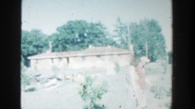 1964: family enjoying a nice day outside in the yard and garden. WISCONSIN