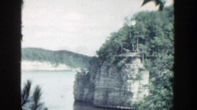 1964: water area boat loading people trees alongside WISCONSIN