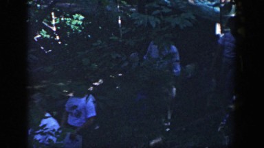 1964: men and woman walking down a path through a wooded area or park WISCONSIN