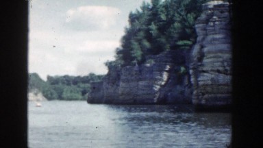 1964: the scenic view of a lake surrounded by huge rock formations WISCONSIN