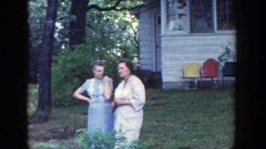 1964: two women talking in the backyard. WISCONSIN