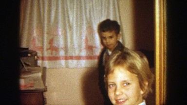 1964: two children are looking at a lens while taking a special moment WISCONSIN