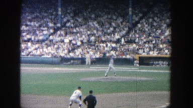 1964: baseball game going on the on the field with a large of number of people