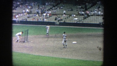 1964: as the pitcher practices his pitch, the batter is preparing