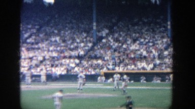 1964: Baseball Players Approach Pitcher on Mound and Relief Pitcher Removes Jacket