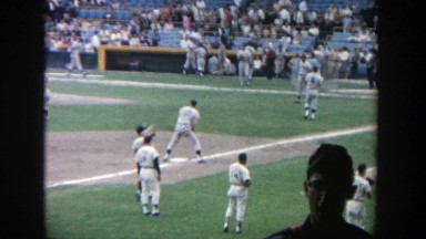1964: A View of Baseball Players Warming Up for a Game on a Sunny Day at Yankee Stadium