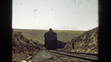 1936: Train Traveling Slowly on the Tracks in California