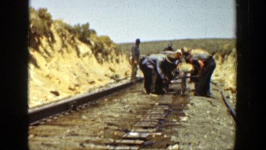 1936: men standing in a row working outside CALIFORNIA