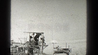 1936: a few men working in the sandy land with some equipments CALIFORNIA