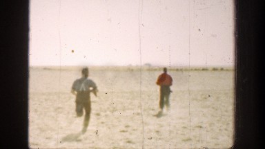 1936: two men running and a bird trying to fly CALIFORNIA