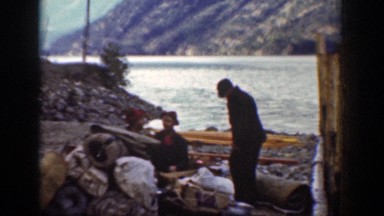 1939: people sitting by a body of water drinking and having a great time CHELAN