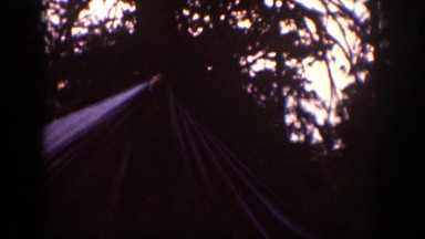 1939: people in front of and near tent which is emitting smoke and collapsing
