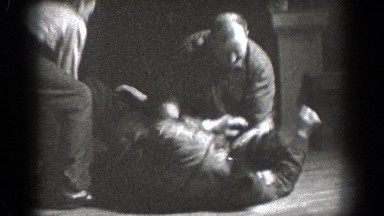 1939: men beat up and harass other man while man eating watches CHELAN