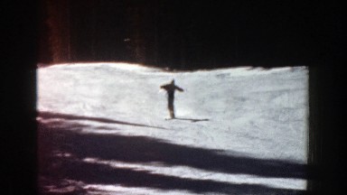 1961: skiing off a snowy mountaintop. ASPEN COLORADO