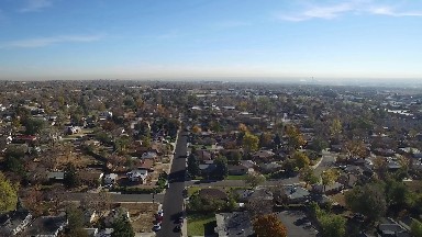 flying over a residential neighborhood in the city at daytime COLORADO