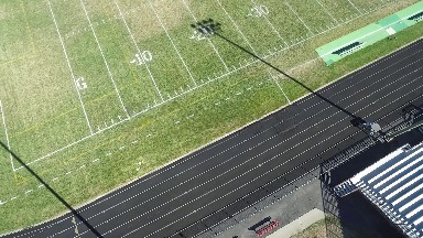 a football field and racing track seen from above COLORADO