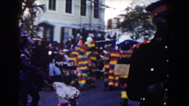 1961: A Group of People Walking Down the Road Dancing in Nassau